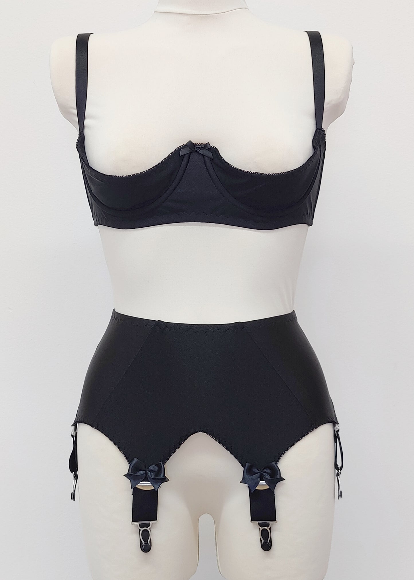 Black Iris garter belt with 6 extra wide straps and with larger bows on the front straps, shown here with matching quarter cup Gina bra