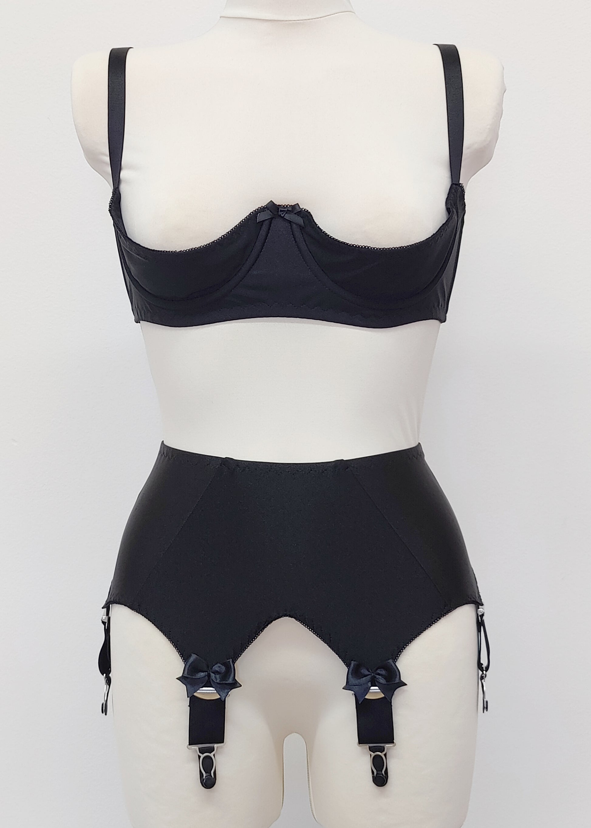 Black Iris garter belt with 6 extra wide straps and with larger bows on the front straps, shown here with matching quarter cup Gina bra