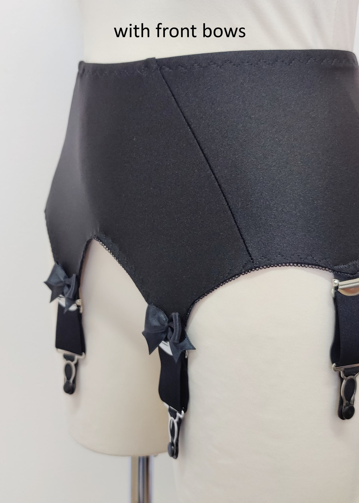 Black Iris garter belt with 6 extra wide straps and with larger bows on the front straps, detail