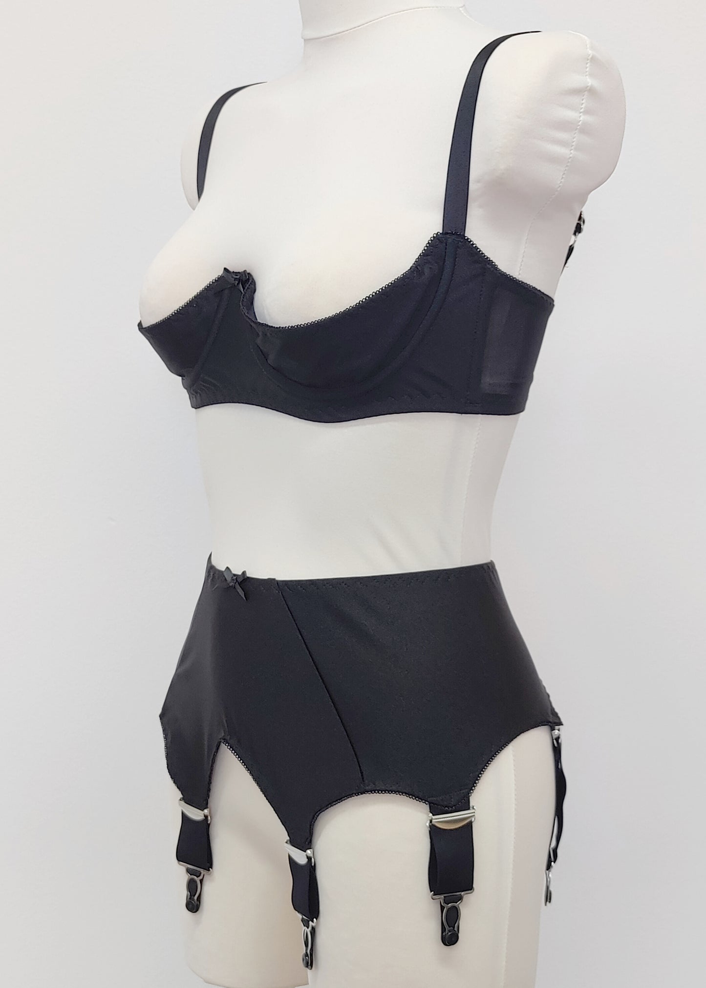 Black Iris garter belt with 6 extra wide straps, shown here with matching quarter cup Gina bra, side view