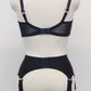 Black Iris garter belt with 6 extra wide straps, shown here with matching quarter cup Gina bra, back view