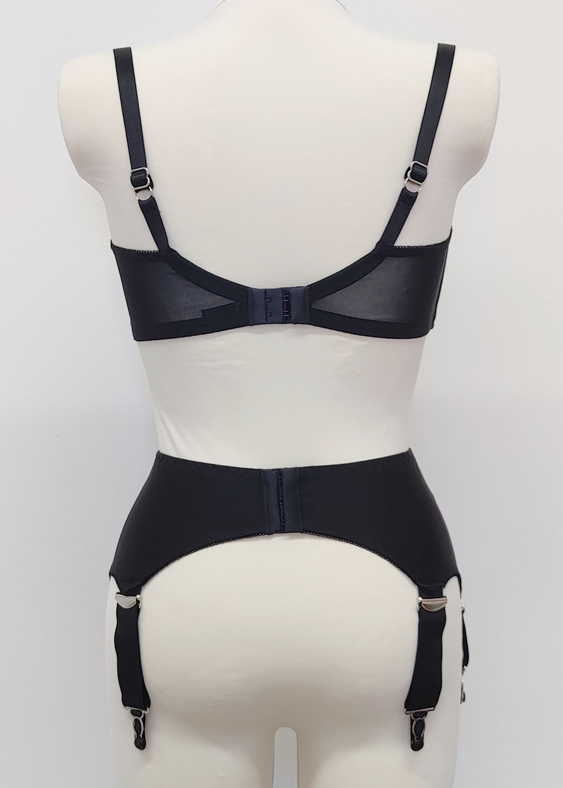 Black Iris garter belt with 6 extra wide straps, shown here with matching quarter cup Gina bra, back view