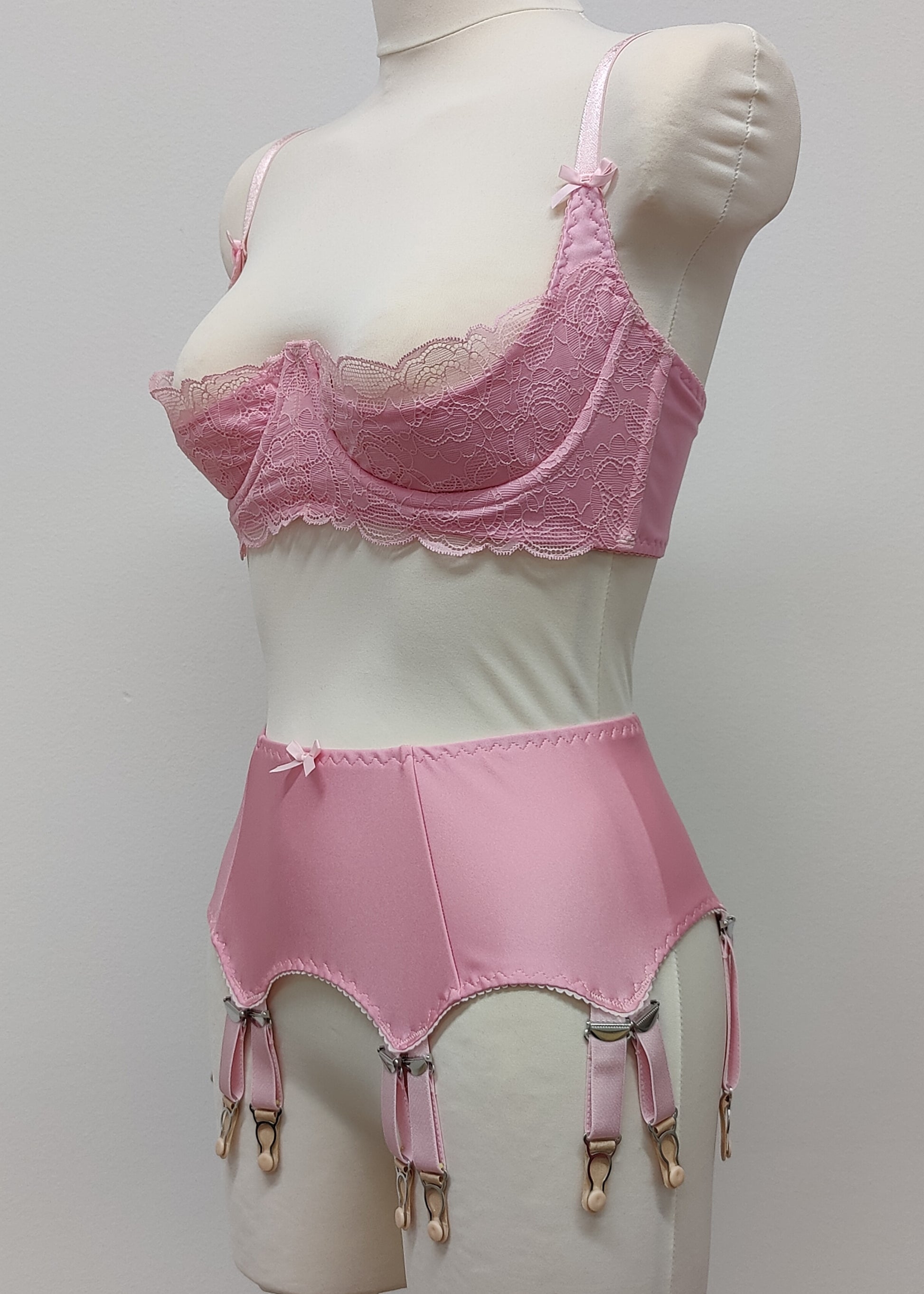 pink retro style garter belt with 6 double straps, here shown with matching Lucrezia bra, side view