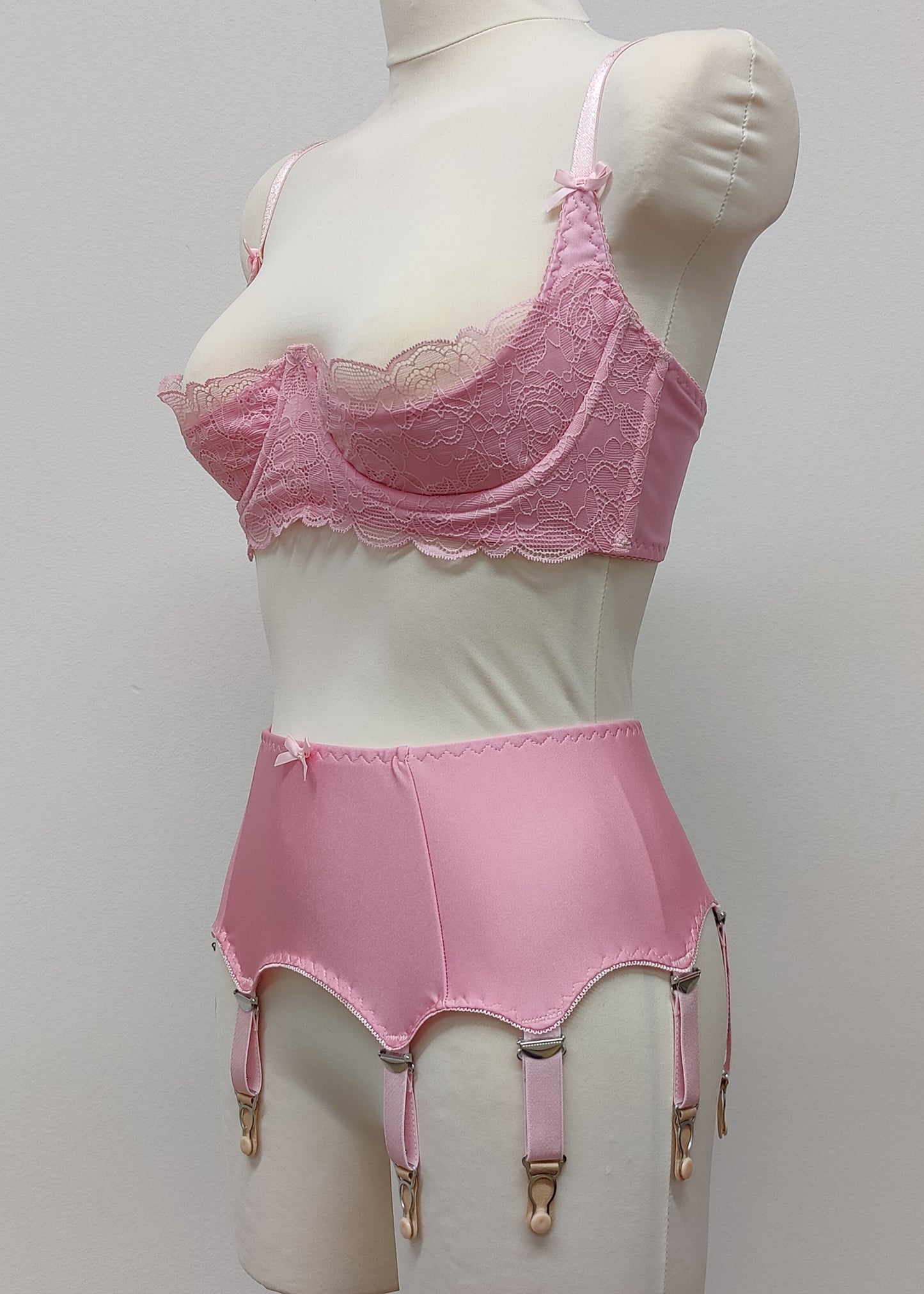 Pink classic Greta garter belt, retro 60's style with 8 adjustable straps and hook and eye closure at the back. Shown with matching  Lucrezia quarter cup bra.