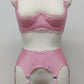 Pink narrow Nina garter belt, 60's style with 6 adjustable straps and hook and eye closure at the back. Shown with matching Lucrezia quarter cup bra.