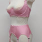 Pink narrow Nina garter belt, 60's style with 6 adjustable straps and hook and eye closure at the back. Shown with matching Lucrezia quarter cup bra, side view