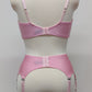 Pink narrow Nina garter belt, 60's style with 6 adjustable straps and hook and eye closure at the back. Shown with matching  bra. back view