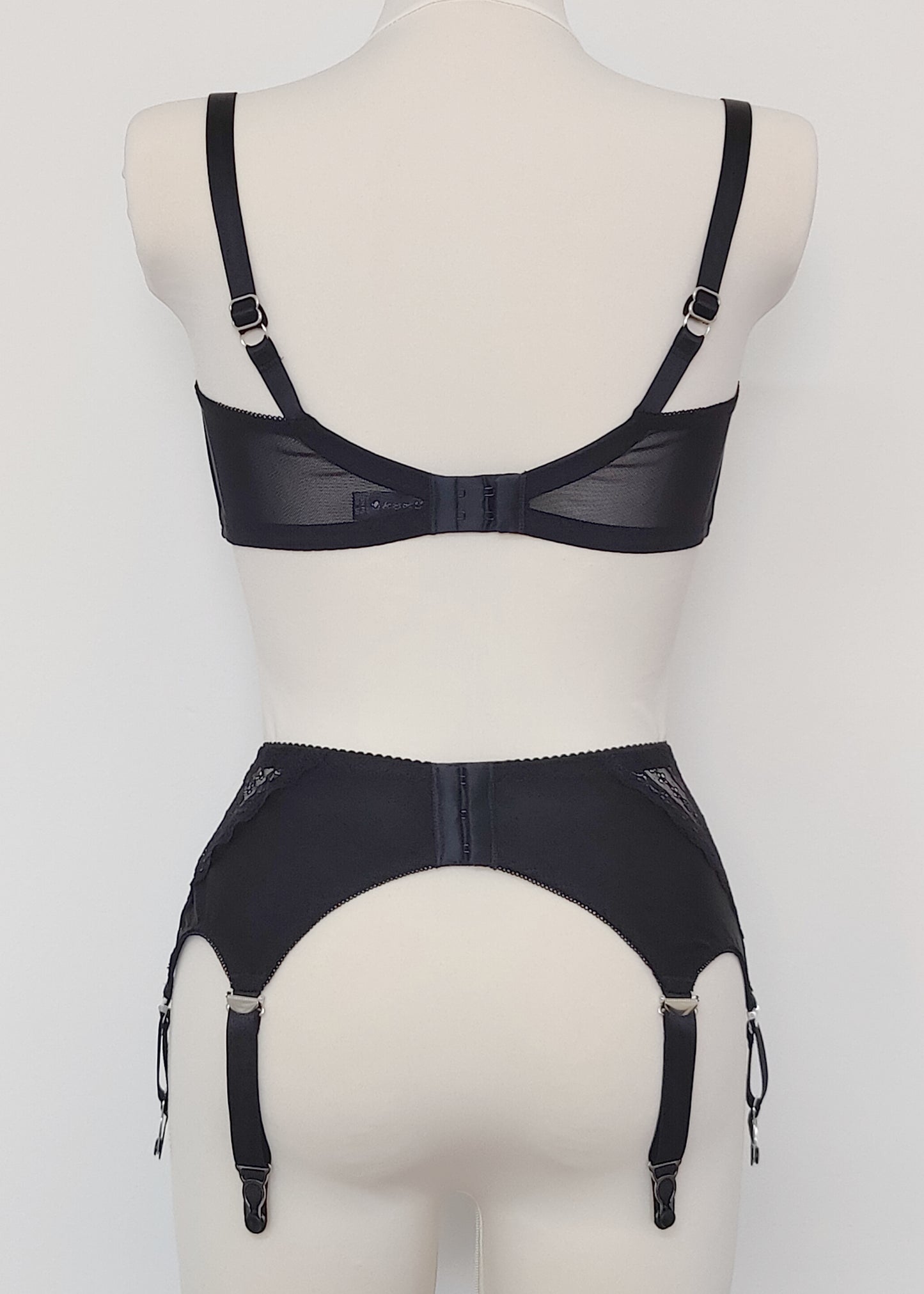 Black Mona garter belt with black lace side panels and 6 adjustable straps, here shown with Gina quarter cup, back view