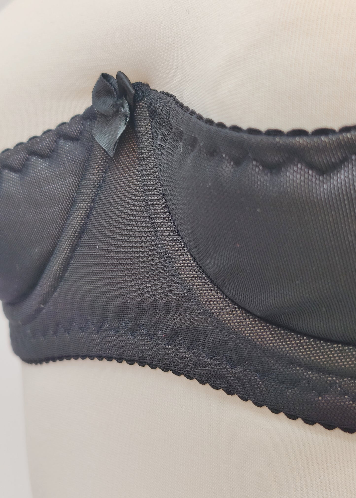 black Ella quarter cup bra made with black mesh fabric underlined with beige padding,  underwired