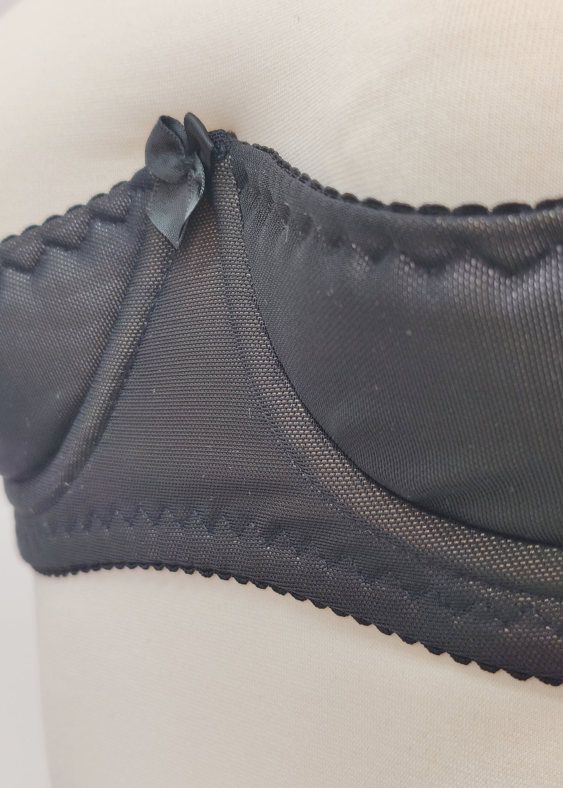 black Ella quarter cup bra made with black mesh fabric underlined with beige padding,  underwired