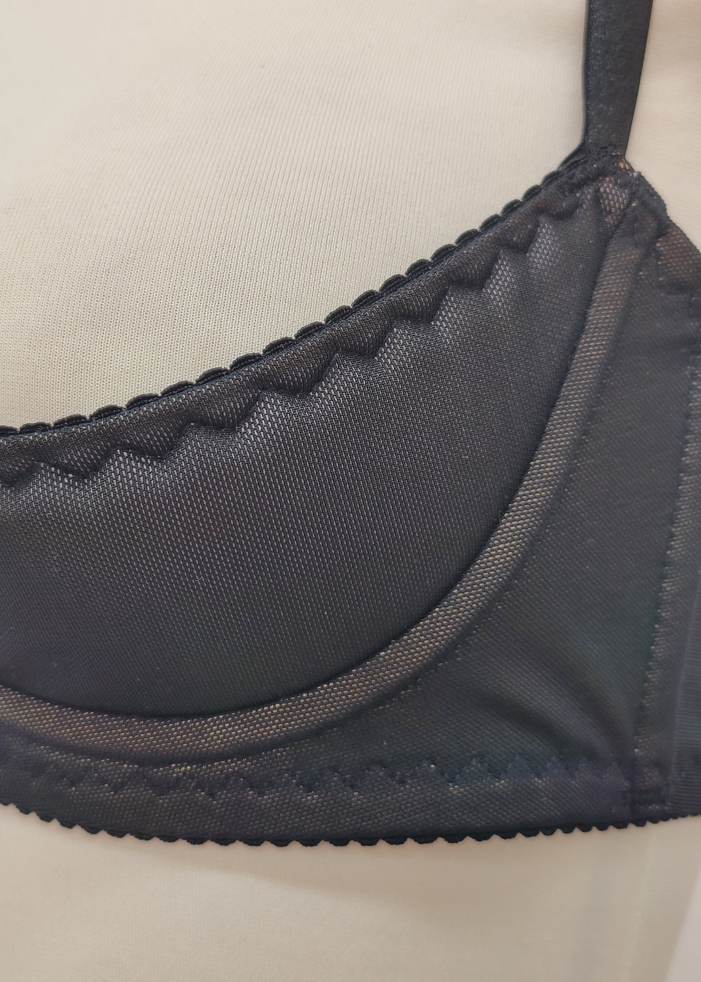 black Ella quarter cup bra made with black mesh fabric underlined with beige padding,  underwired