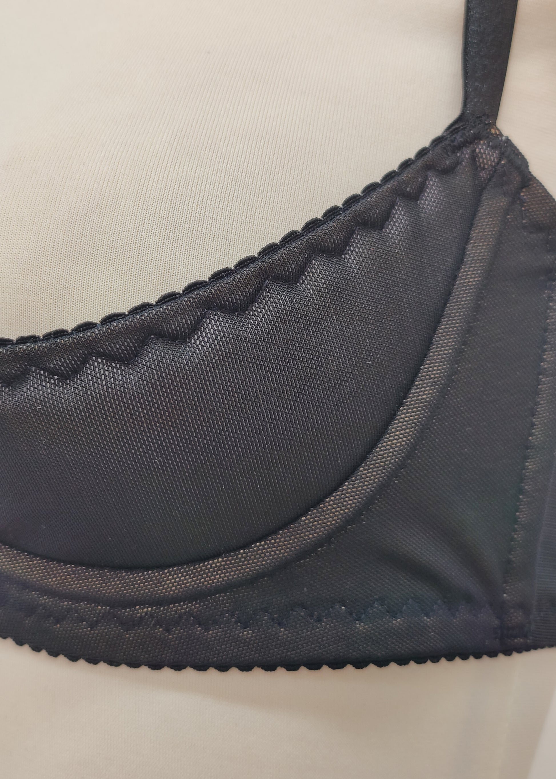 black Ella quarter cup bra made with black mesh fabric underlined with beige padding,  underwired