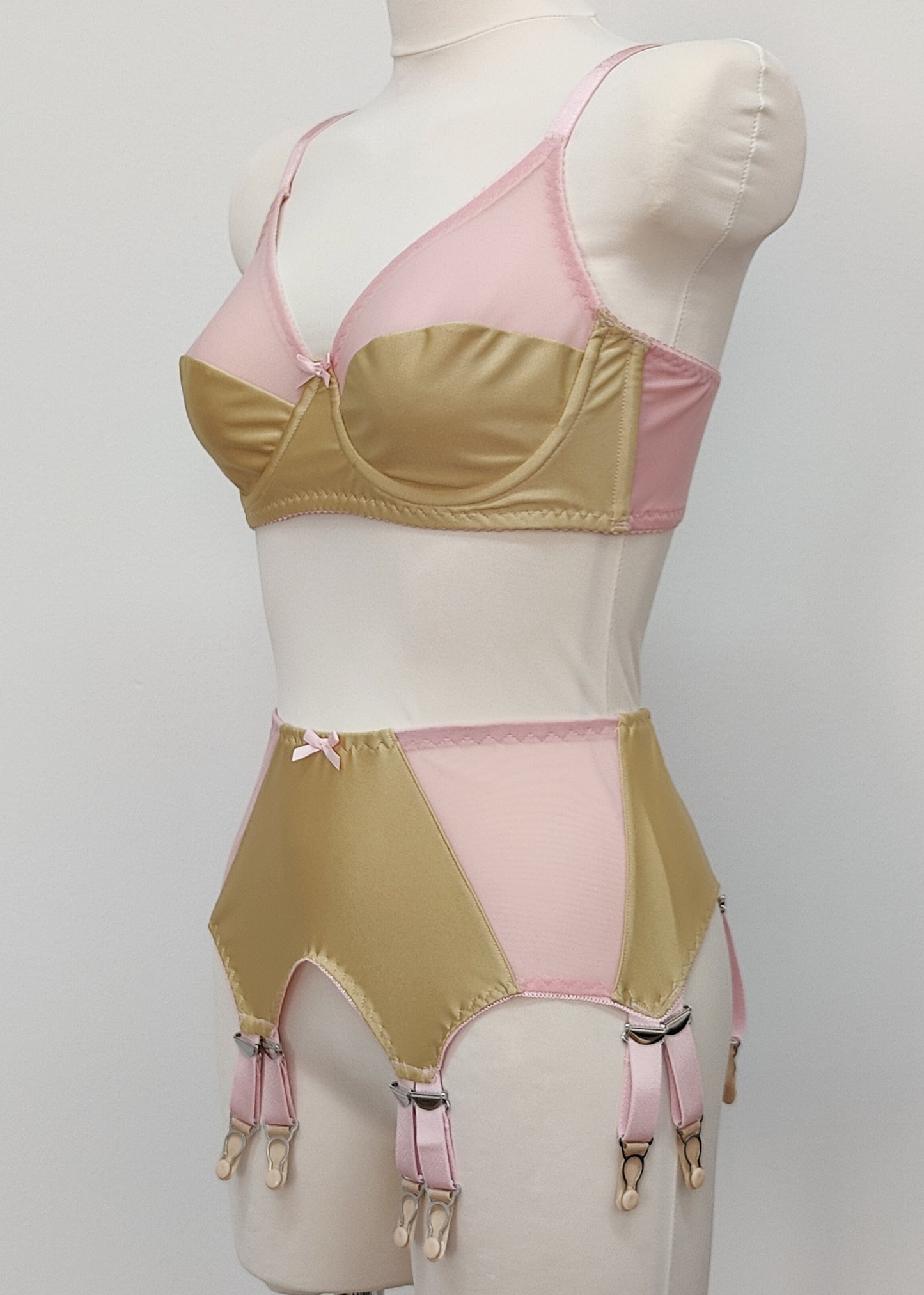 beige Audrey bra with pink sheer upper part of the cup,straps and trim, here shown with matching Stella garter belt, side view