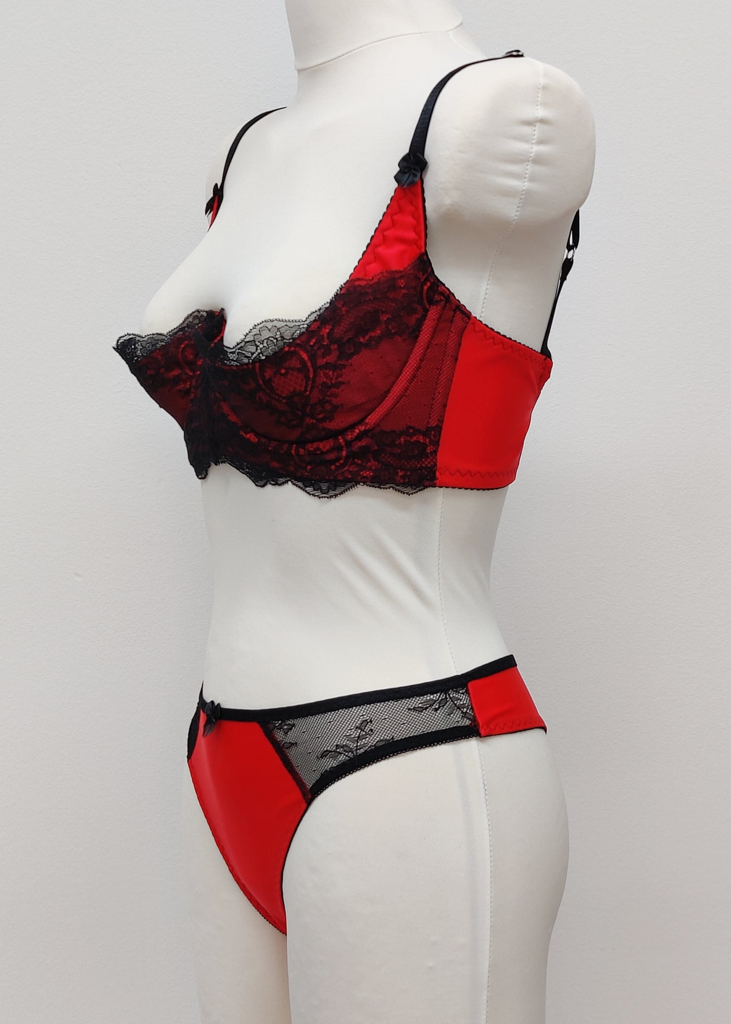 red with black lace quarter cup Lucrezia bra, shown with matching Zigi thong panties, side view