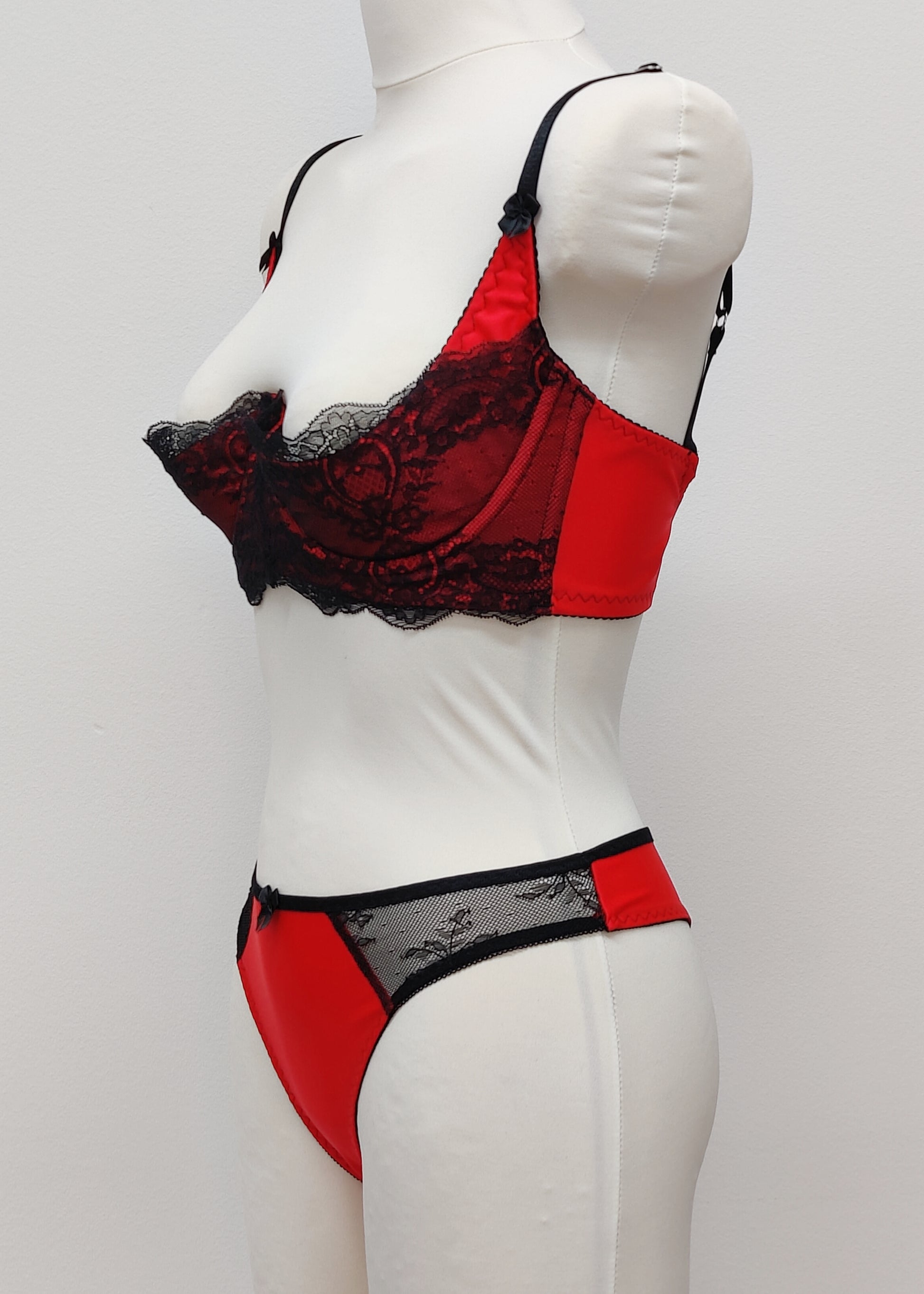 red with black lace quarter cup Lucrezia bra, shown with matching Zigi thong panties, side view