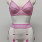 Full cup Lily bra made with fuchsia pink-star mesh fabric, here presented with matching customized Summer suspender belt