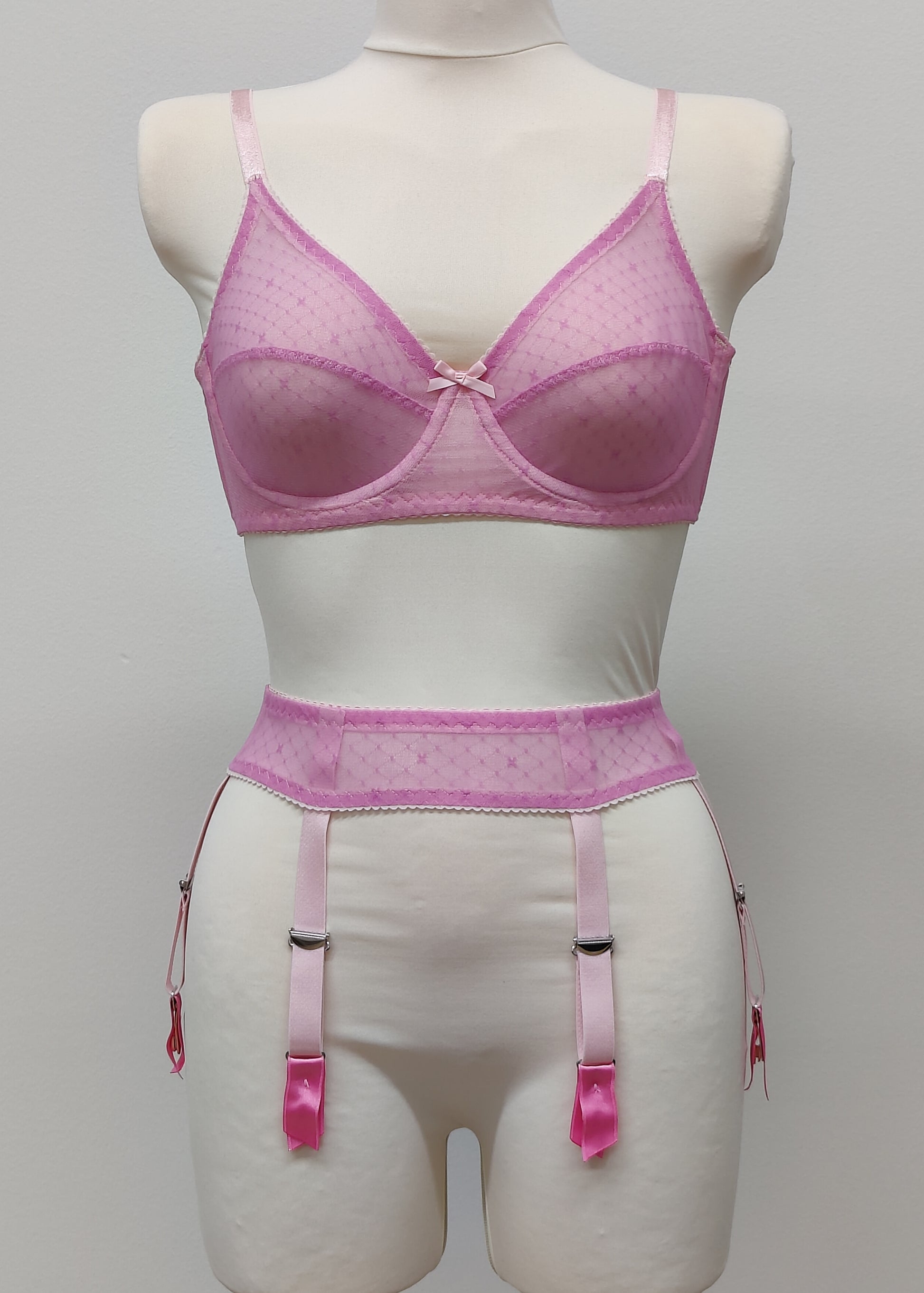 Full cup Lily bra made with fuchsia pink-star mesh fabric, here presented with matching customized Summer suspender belt