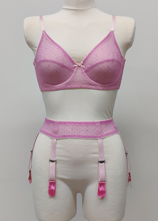 Full cup Lily bra made with fuchsia pink-star mesh fabric, here presented with matching customized Summer suspender belt