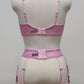 Full cup Lily bra made with fuchsia pink-star mesh fabric, here presented with matching customized Summer suspender belt, back view