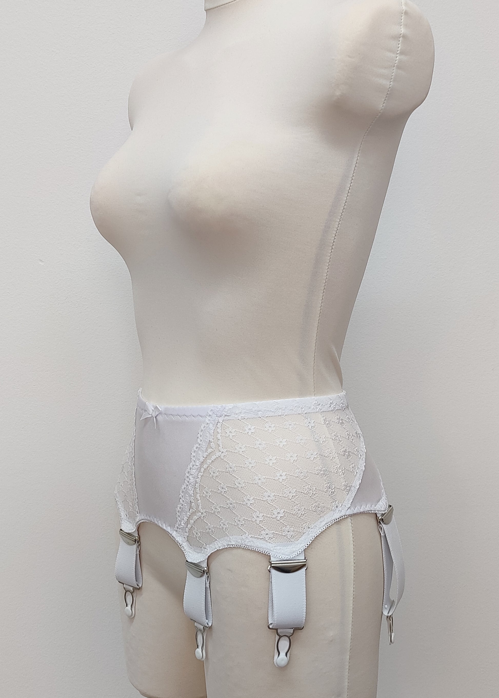 Wide retro style Liliane garter belt with white lace, 6 wide adjustable straps and hook and eye closure, side view