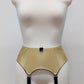 Beige Greta 4 strap garter belt with black straps on a mannequin against a white background