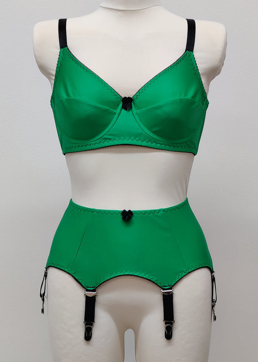 Green lingerie set with 6 strap Greta garter belt and full cup bra, on a mannequin against a gray background