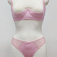 Mannequin wearing a  pink Gina quarter cup bra and  Mia thong with sheer side panels 