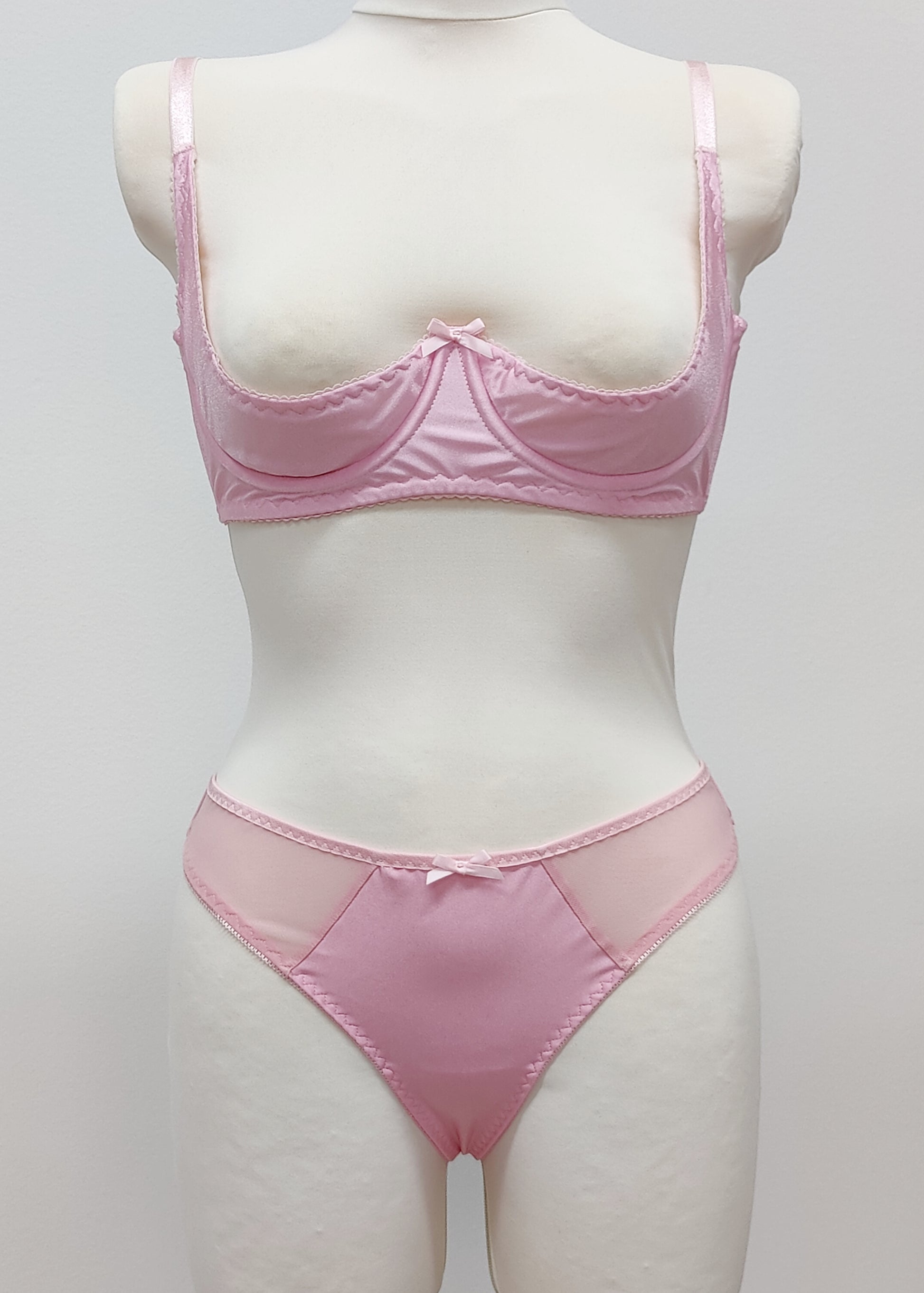 Mannequin wearing a  pink Gina quarter cup bra and  Mia thong with sheer side panels 