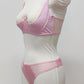 Mannequin wearing a  pink Gina quarter cup bra and Mia thong with sheer pink side panels 