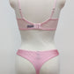 Mannequin wearing a  pink Gina quarter cup bra and Mia thong with sheer pink side panels, back view