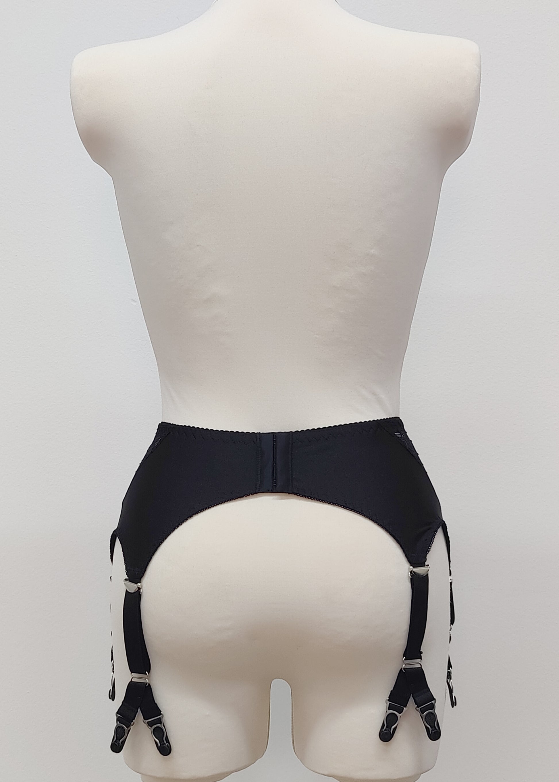 High waist Rita garter belt in black color with black lace side panels and 6 Y strap, back view