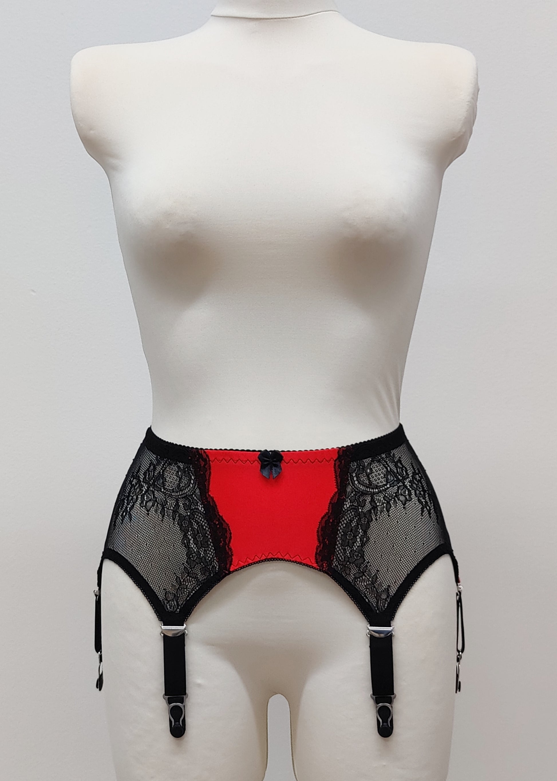 High waist Mona garter belt in red color with black lace side panels and 6 adjustable straps