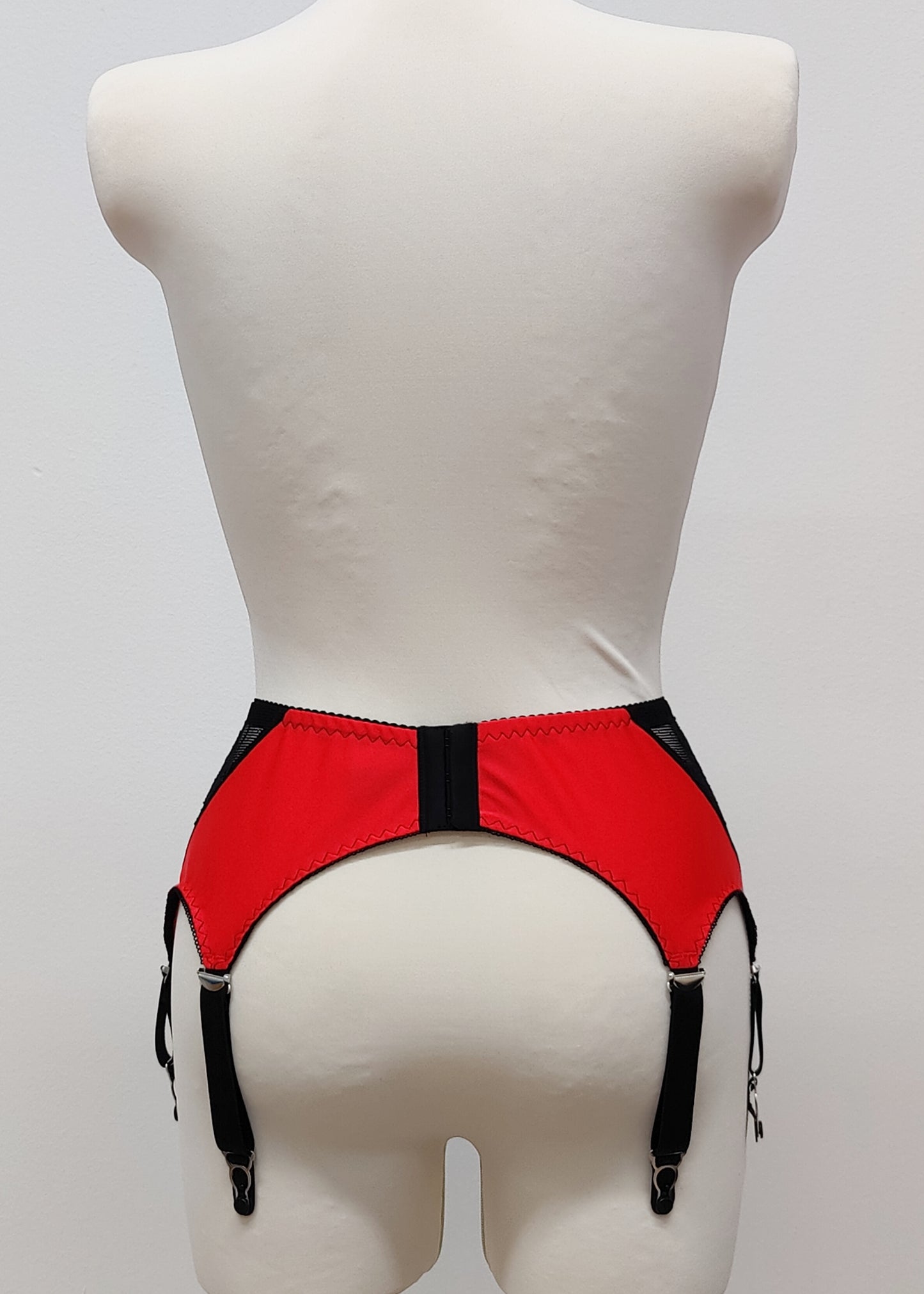 High waist Mona garter belt in red color with black lace side panels and 6 adjustable straps, back view