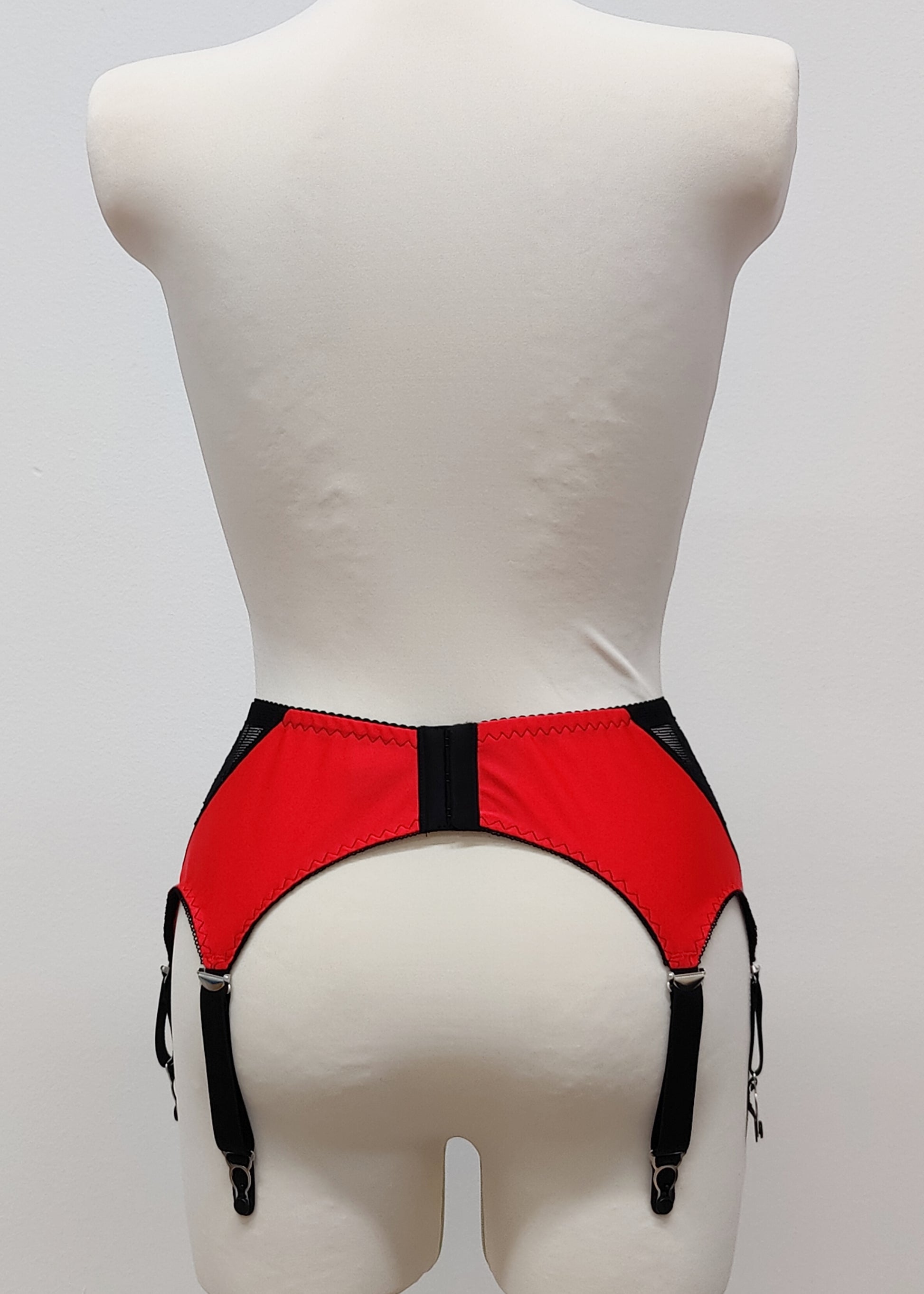 High waist Mona garter belt in red color with black lace side panels and 6 adjustable straps, back view