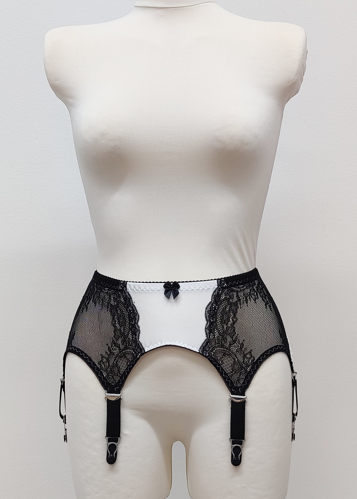 High waist Mona garter belt in white color with black lace side panels and 6 adjustable straps