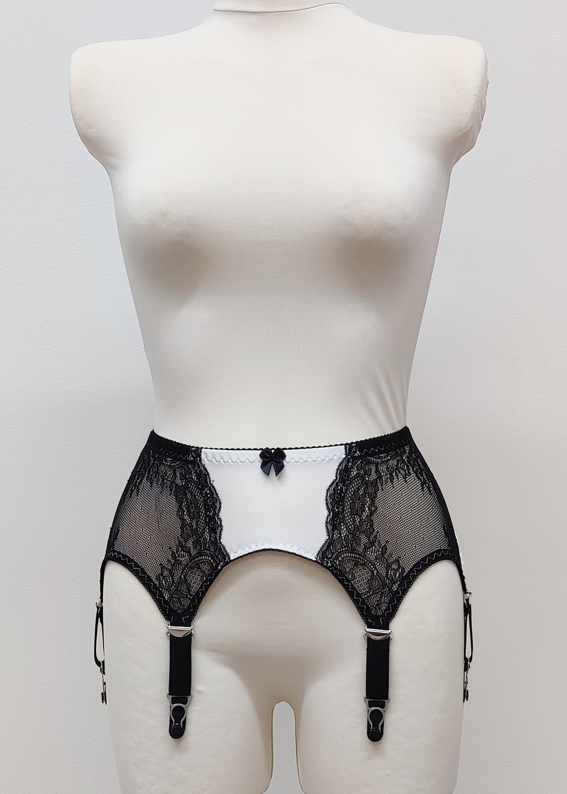 High waist Mona garter belt in white color with black lace side panels and 6 adjustable straps