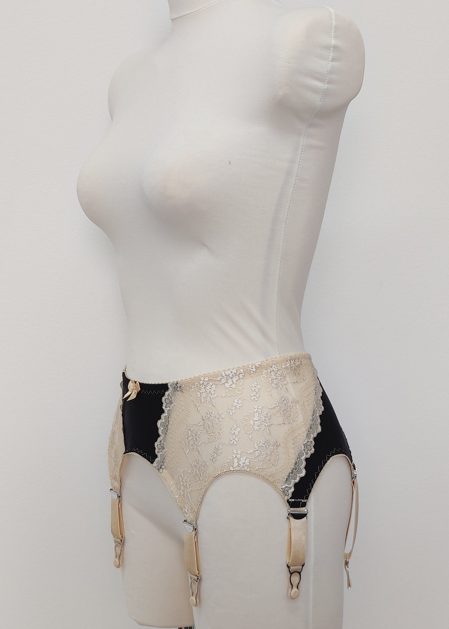 Black with beige lace 6 strap retro style Mona garter belt with side lace panels, side view