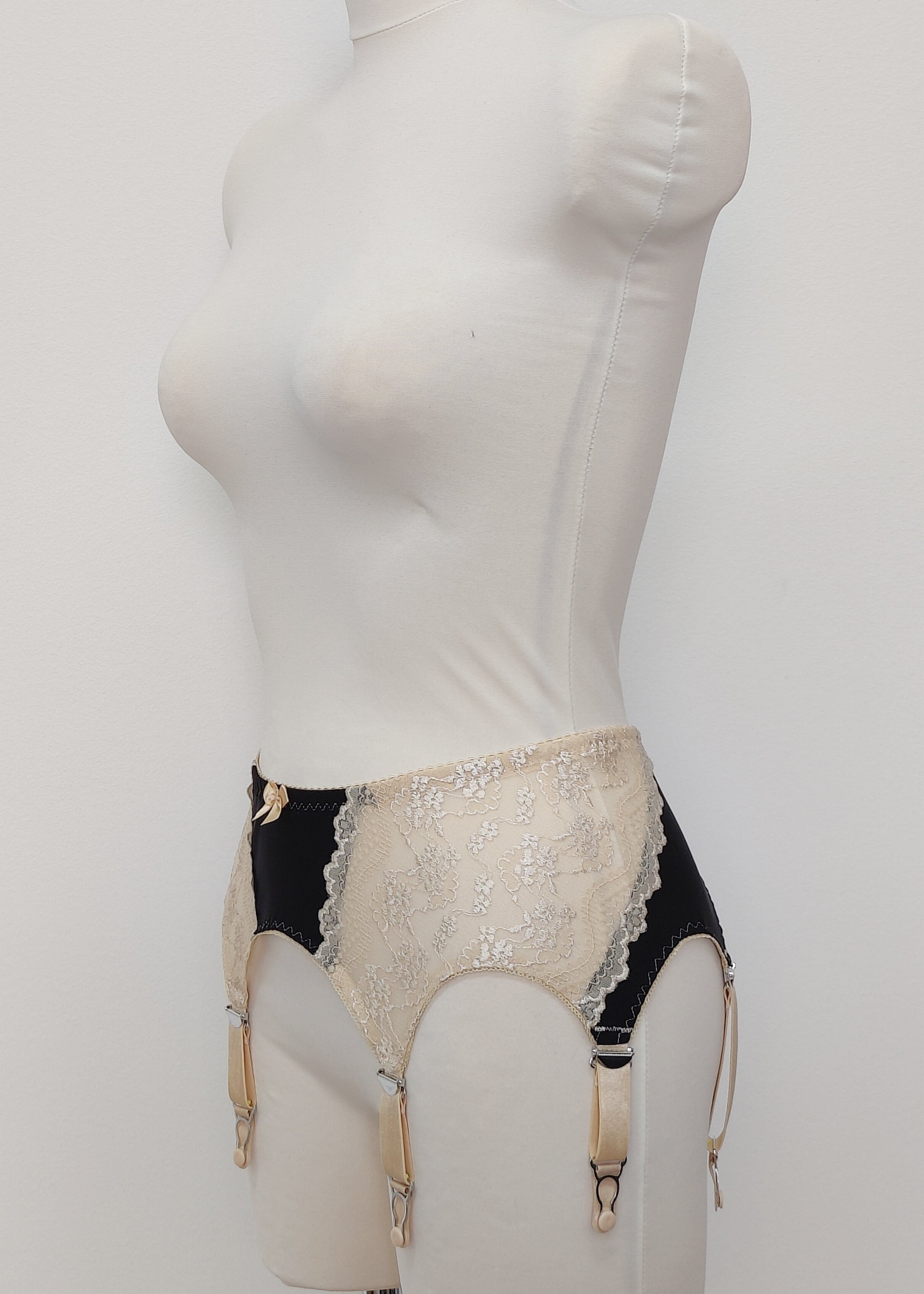Black with beige lace 6 strap retro style Mona garter belt with side lace panels, side view