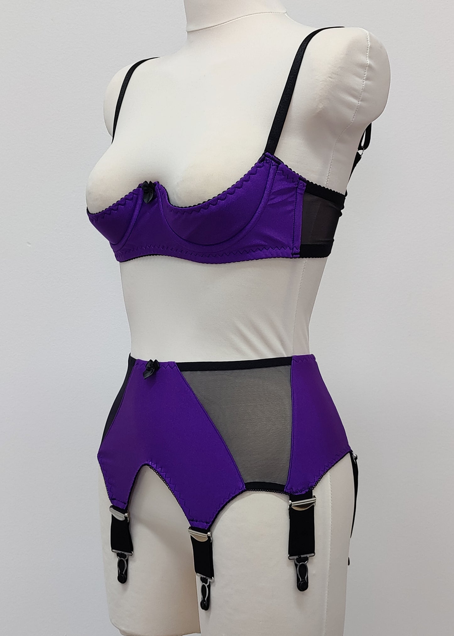 wide, vintage style, Grace garter belt, purple with black mesh panels and 6 extra wide straps, shown with matching Gina quarter cup bra, side view