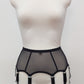 Black sheer 8 strap garter belt on a mannequin against a white background