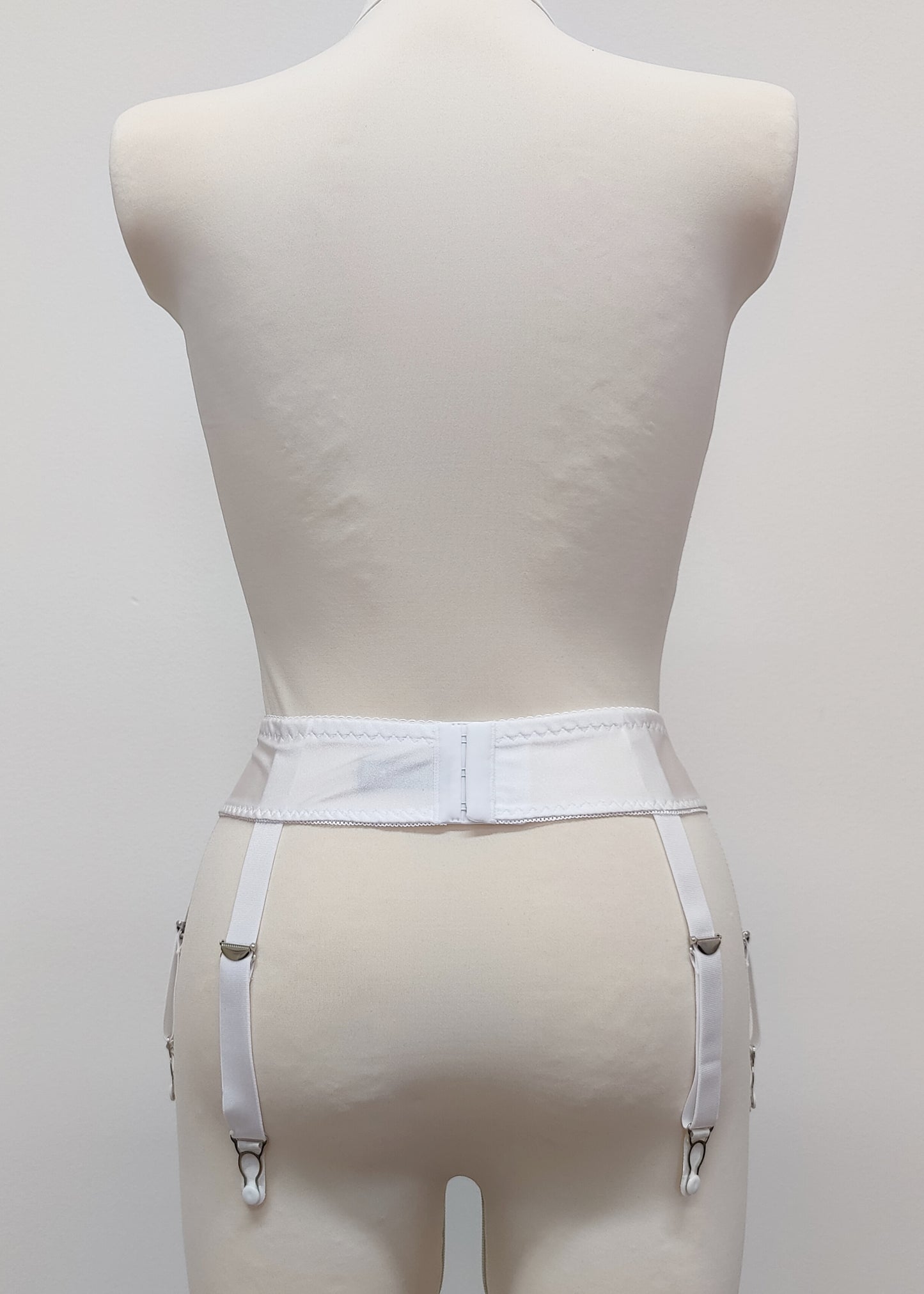 white narrow 60's style Summer garter belt with 6 straps, back view