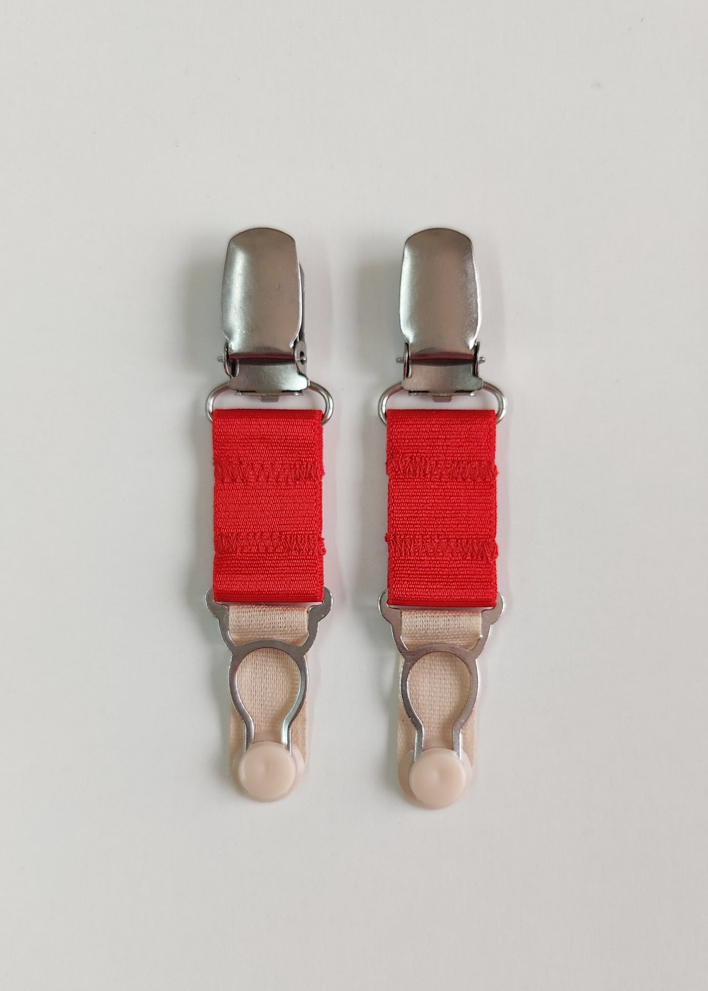 Pair of clip on suspenders with red straps and metal stocking clips, 10cm /2" long