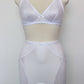 white bralette with delicate shiny floral pattern, Here shown with matching Penelope girdle