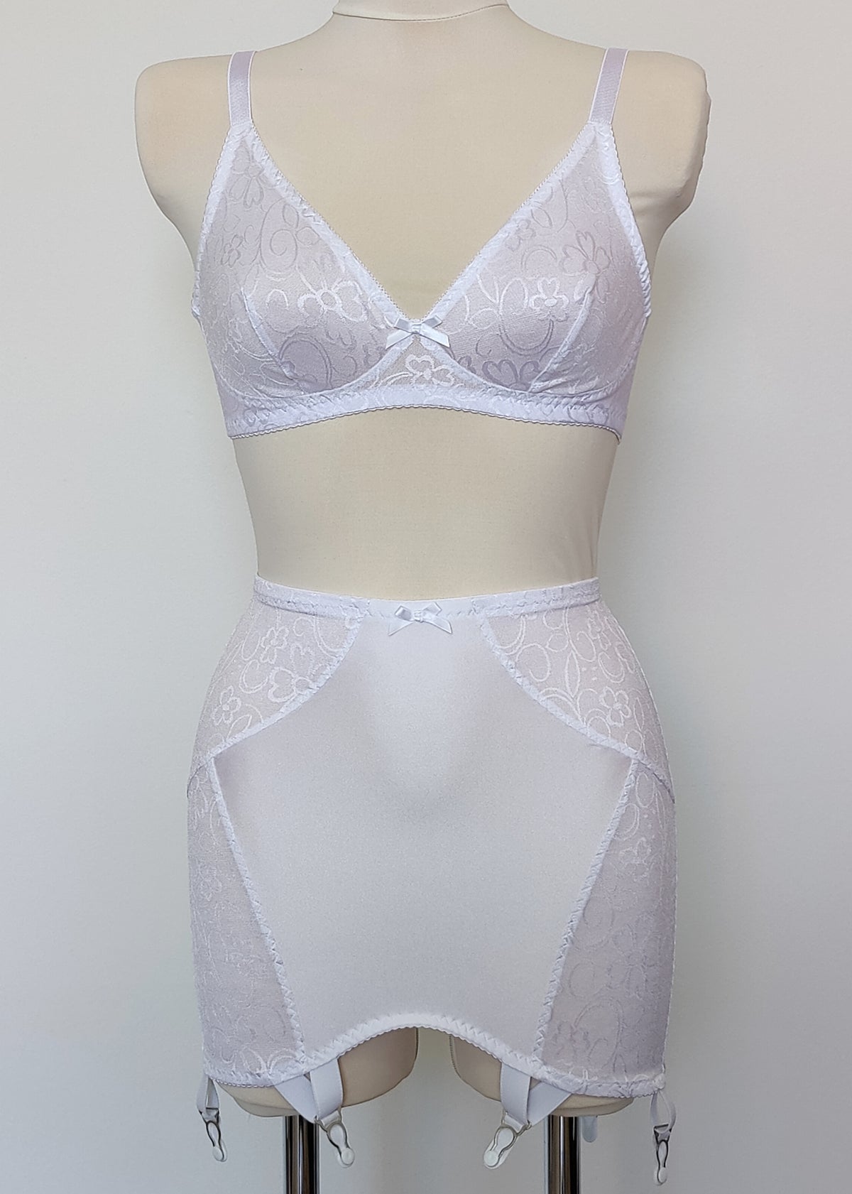 white bralette with delicate shiny floral pattern, Here shown with matching Penelope girdle