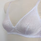 white bralette with delicate shiny floral pattern, detail