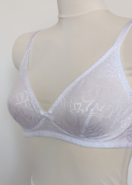 white bralette with delicate shiny floral pattern, detail