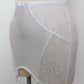 white open bottom girdle with delicate shiny floral pattern, with 6 non adjustable v straps with cotton backed grips, detail