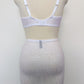 white open bottom girdle with 6 non adjustable v straps with cotton backed grips, here shown with matching Bella bralette, back view