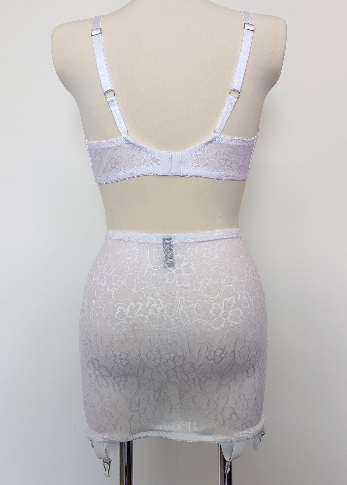 white open bottom girdle with 6 non adjustable v straps with cotton backed grips, here shown with matching Bella bralette, back view