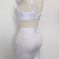 white Bella bralette with delicate shiny floral pattern, Here shown with matching Penelope girdle, back view
